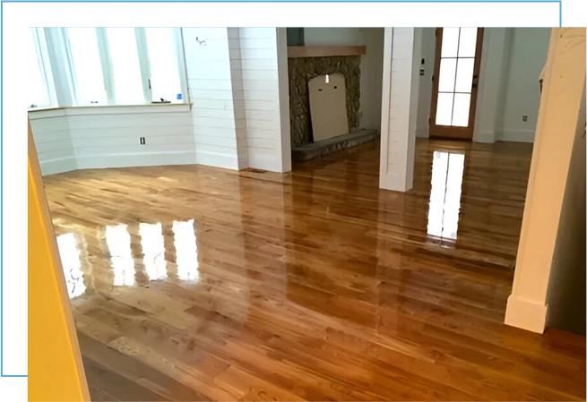 A room with wood floors and white walls.